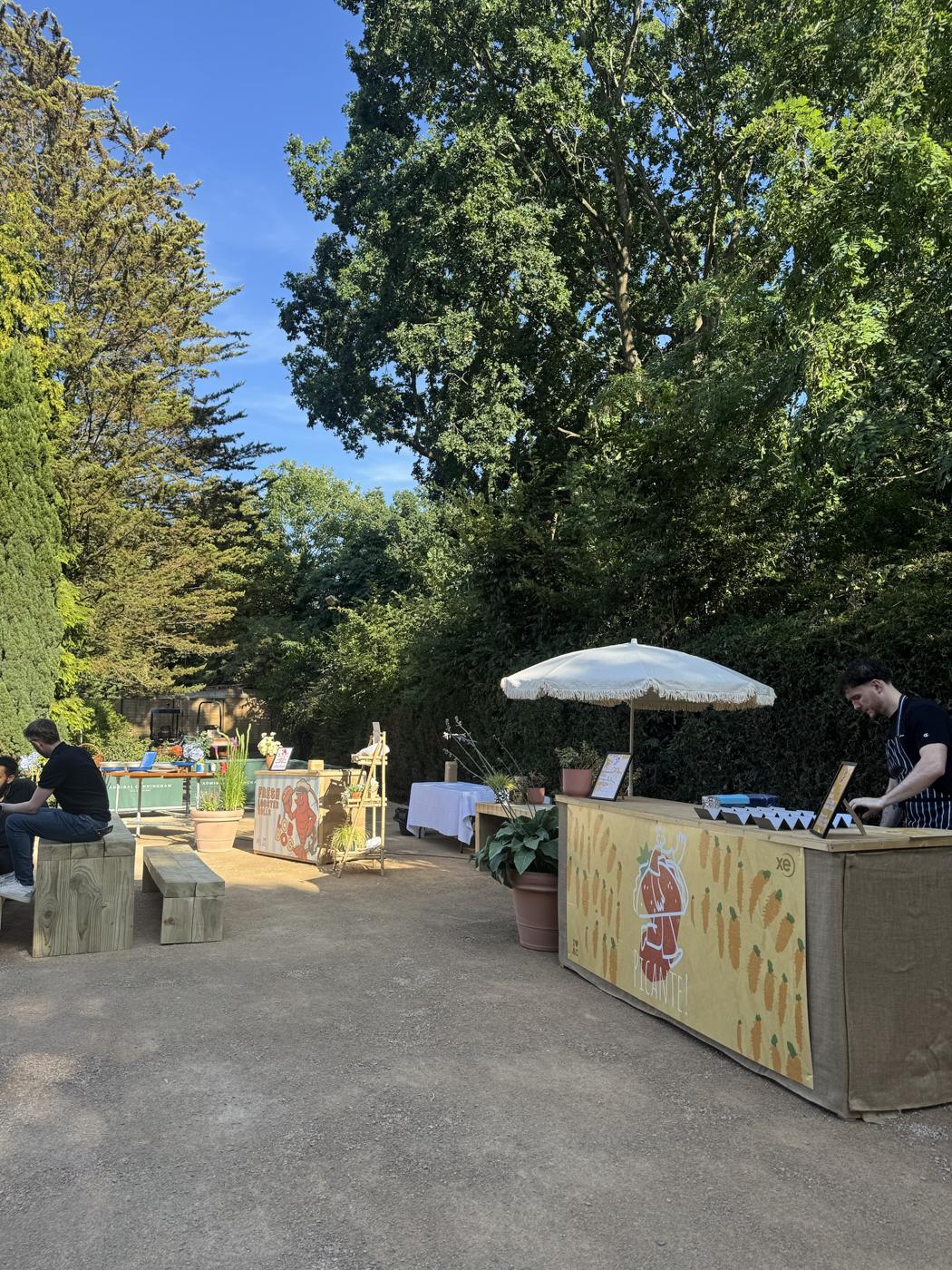 Street-food stalls and a bar set up for a private garden festival