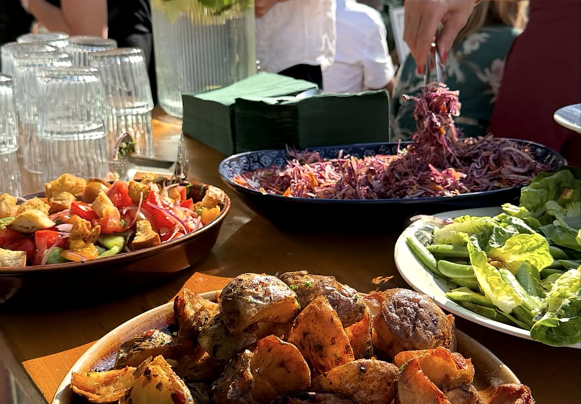Wedding buffet of roast potatoes, salads and slaw